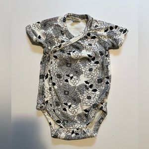Kate Quinn floral wrap onesie.